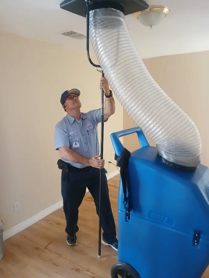 Furnace Tune-Up technician using HEPA equipment in Mountain Home
